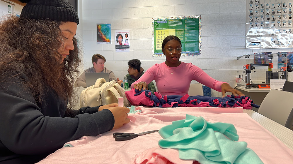 Members of the DECA Club make blankets to help keep animals warm at local shelters.