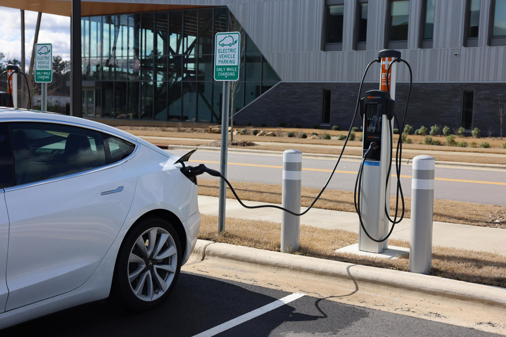 A car is plugged into an electric vehicle charger at Wake Tech East.