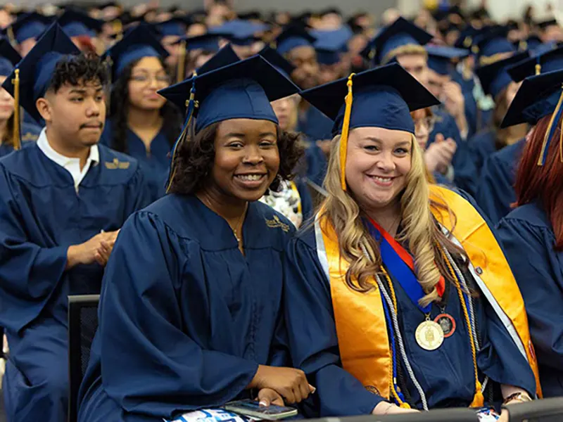 Image of group of Wake Tech students wearing regalia during graduation