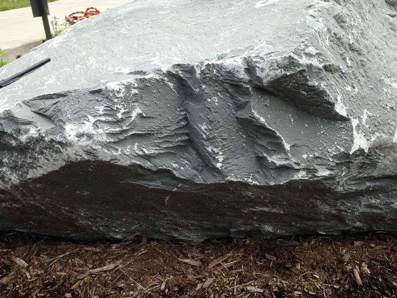 Figure 5: This image shows the edge of the meta-tuff boulder, showing the foliation layers revealed there.