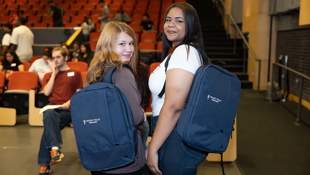 Eagle Start students show off their Wake Tech backpacks.