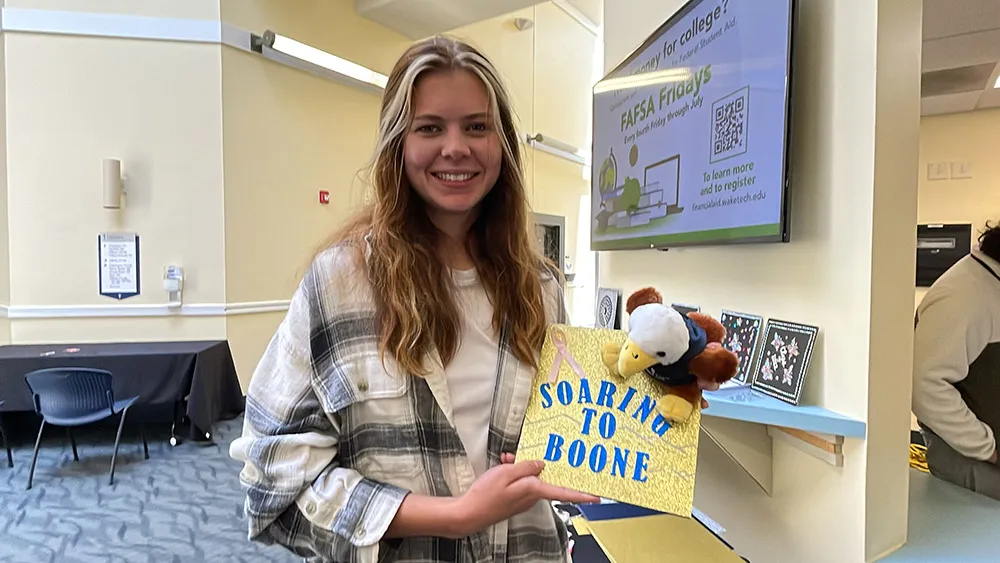 Students decorate their mortarboards during Hats Off to Graduation events.