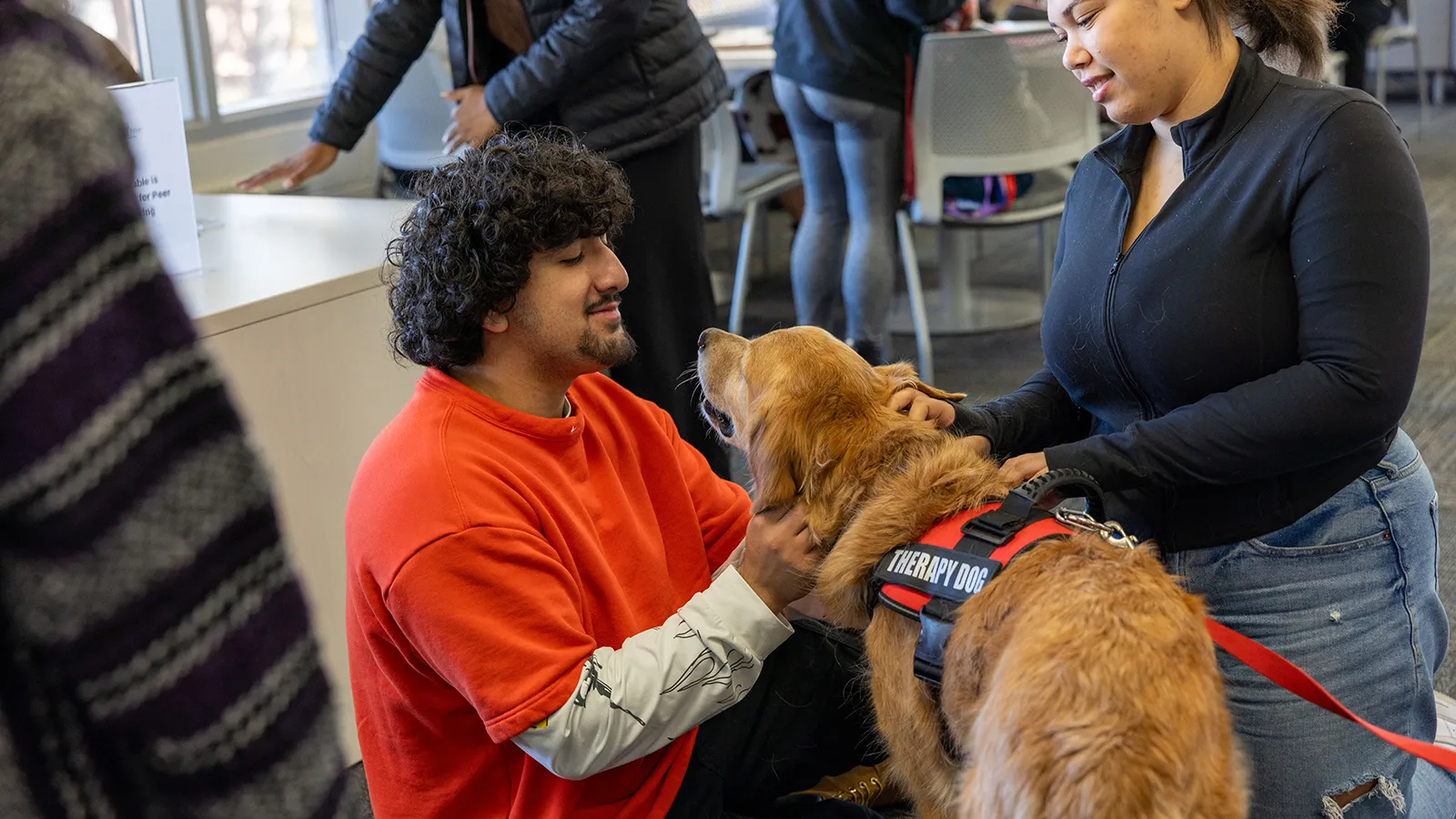 Coffee and Cuddles events with therapy dogs help ease the end-of-semester stress.