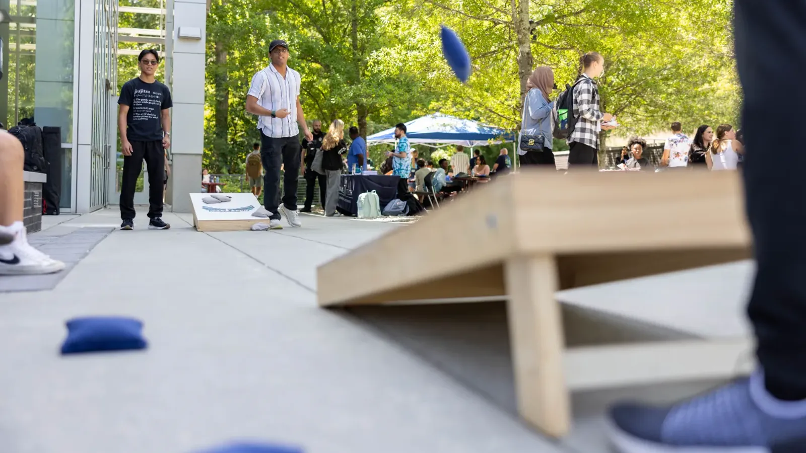 Students play cornhole during the Resource Fair on Scott Northern Wake Campus.