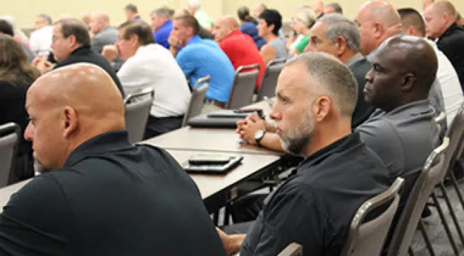 Photo showing a group of law enforcement students being trained in a classroom