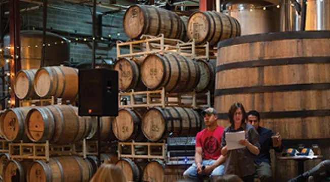 An image showing stacks of beer barrels