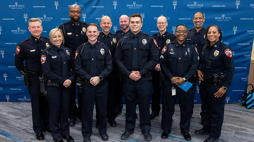 Thirteen cadets celebrate their graduation from Wake Tech's Basic Law Enforcement Training Academy.