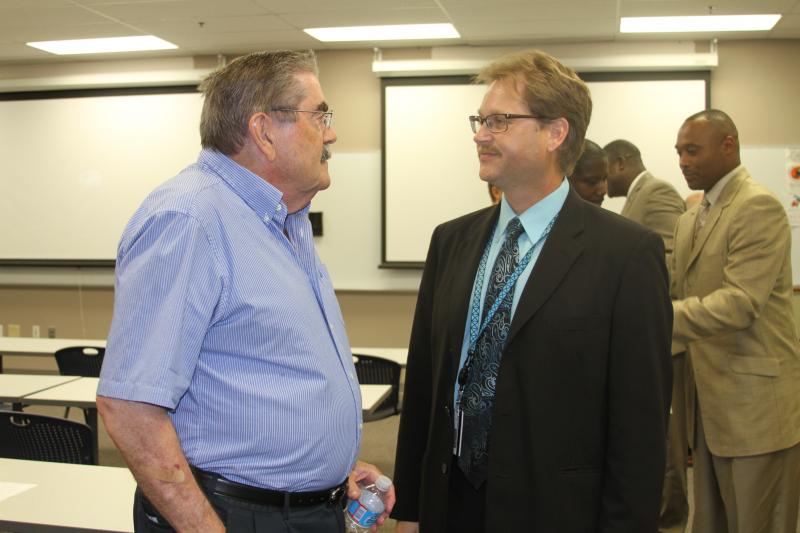 Bud Coggins, Wake Tech Foundation Board member and Bryan Ryan, SVP Curriculum Education Services