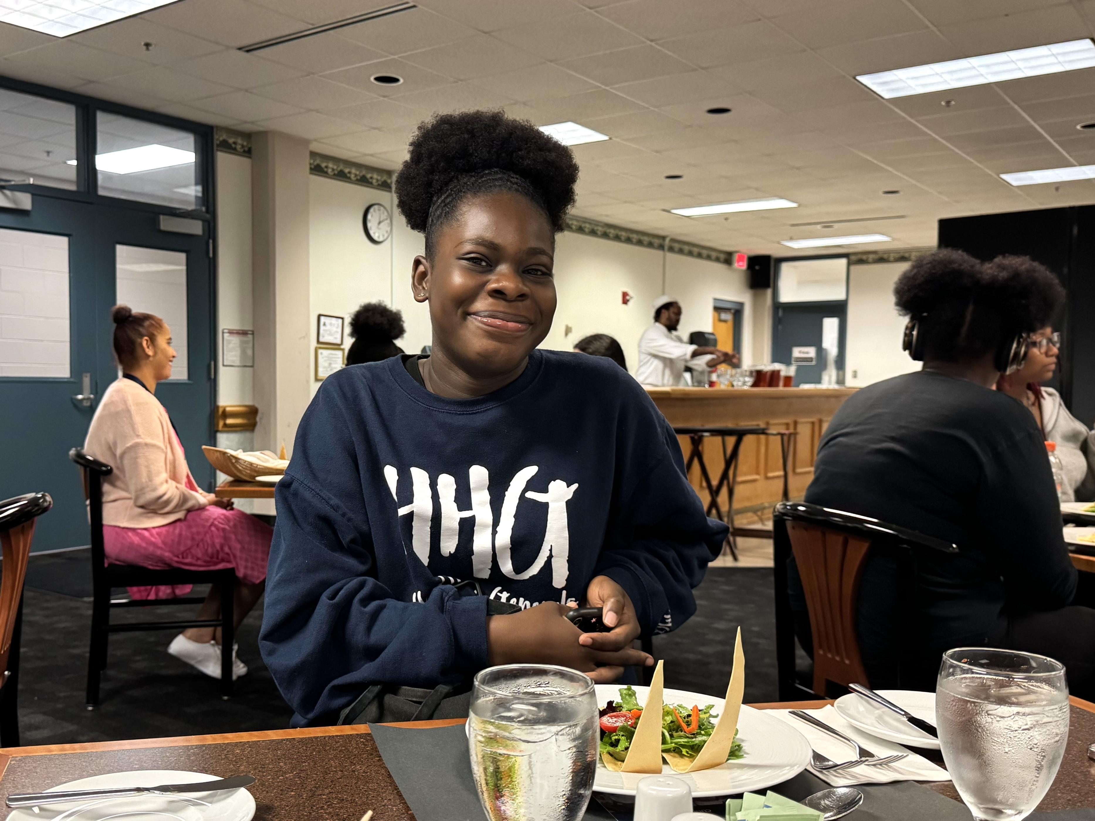 A woman enjoys a meal at Flavors, the student-run restaurant at Wake Tech.