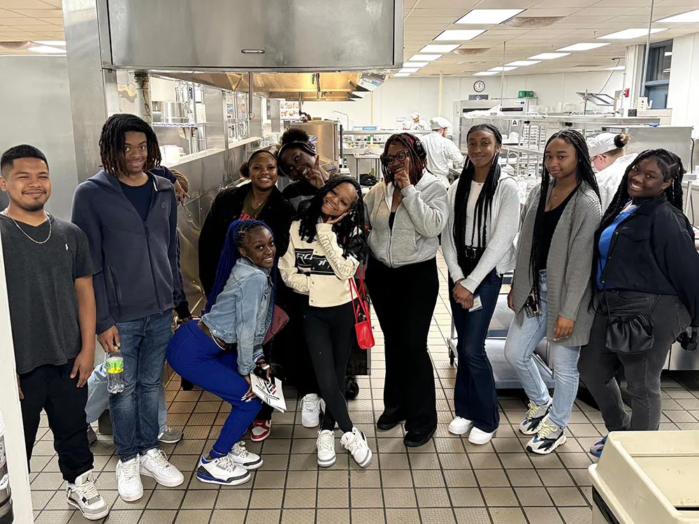 Southeast Raleigh High School culinary students pose for a photo after touring Wake Tech kitchens.