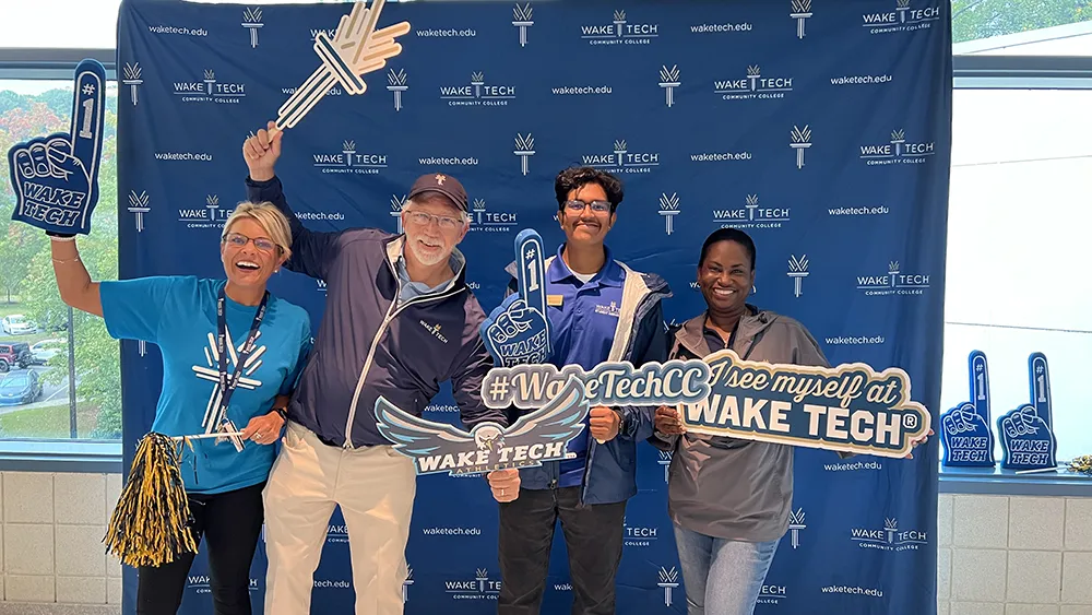 Wake Tech President Dr. Scott Ralls and college staff pose for a photo before the 2023 Fall Open House.