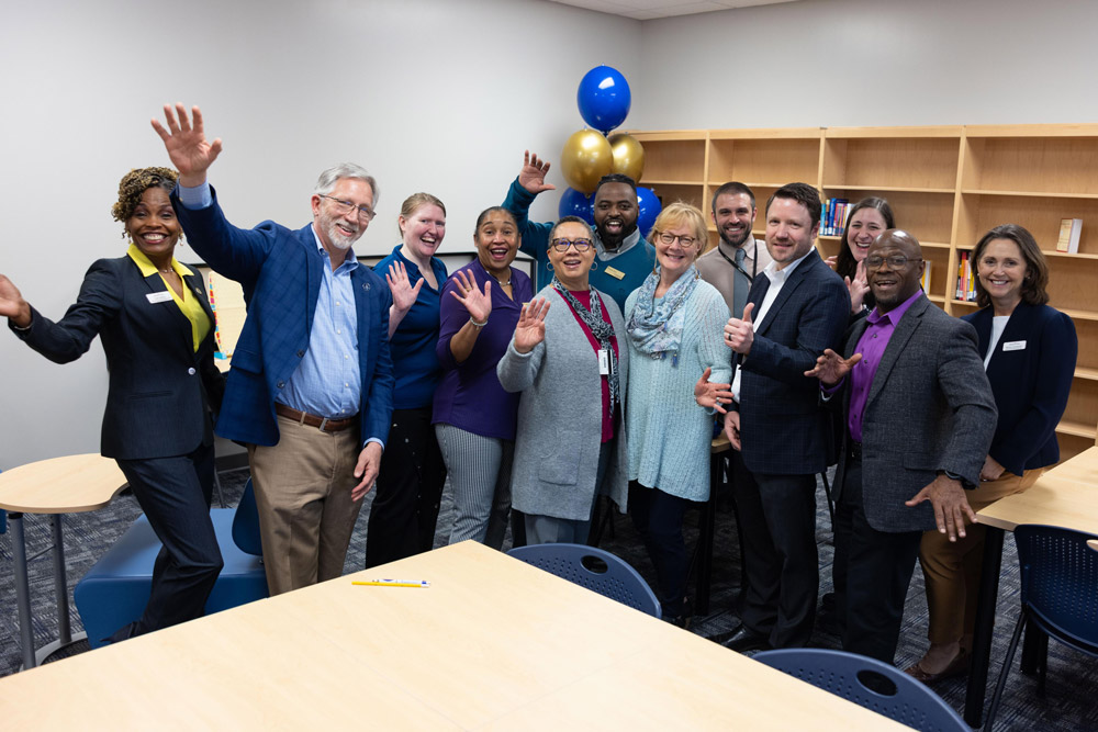 Wake Tech administrators and staff celebrate the opening of a library and tutoring space at the Beltline Education Center.