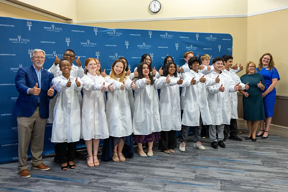 Wake Tech Biotechnology students show off their new lab coats.