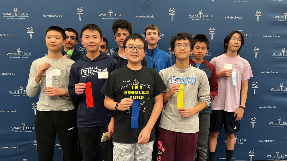 Winners of the North Carolina Regional Math Contest Level II test show off their ribbons.