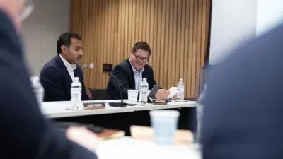  Sharat Nagaraj and "Buzz" Crosby attend Wake Tech Board of Trustees meeting.