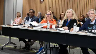  Sharat Nagaraj and "Buzz" Crosby attend Wake Tech Board of Trustees meeting.