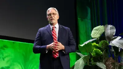 Matt Smith, VP of Development and Strategic Partnerships, left, and President Dr. Scott Ralls perform during the 2025 Wake Tech IGNITE event.