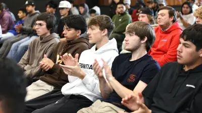 Wake Tech students listen as NASCAR driver Ross Chastain discusses driving safety.