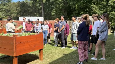 Wake Tech students are growing tomato plants in a vegetable garden on Southern Wake Campus.