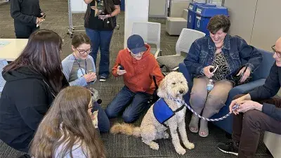 A therapy dog helps students get a break from studying.