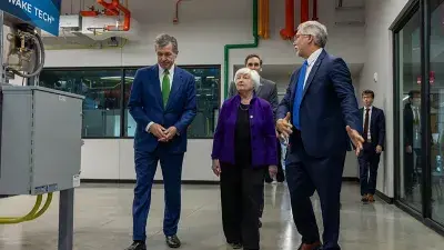 U.S. Treasury Secretary Janet Yellen takes North Carolina Gov. Roy Cooper for a ride in an electric vehicle.