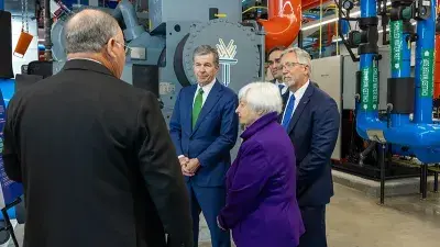 U.S. Treasury Secretary Janet Yellen takes North Carolina Gov. Roy Cooper for a ride in an electric vehicle.