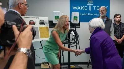 U.S. Treasury Secretary Janet Yellen takes North Carolina Gov. Roy Cooper for a ride in an electric vehicle.