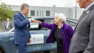 U.S. Treasury Secretary Janet Yellen takes North Carolina Gov. Roy Cooper for a ride in an electric vehicle.