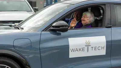 U.S. Treasury Secretary Janet Yellen takes North Carolina Gov. Roy Cooper for a ride in an electric vehicle.