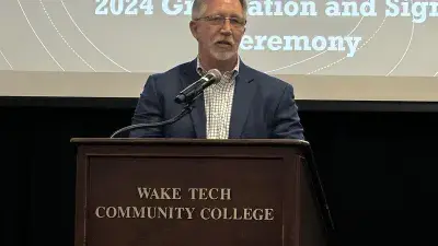 Wake Tech President Dr. Scott Ralls speaks to apprentices at the NCTAP ceremony.