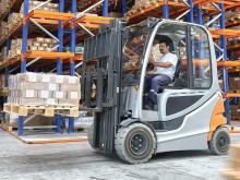 Forklift operating in warehouse